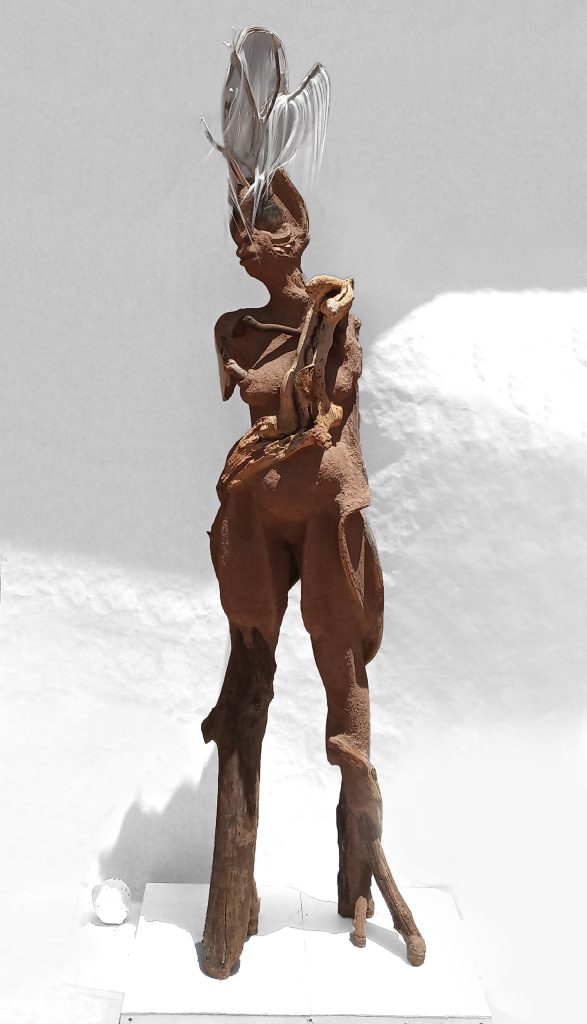 Wangechi Mutu Sentinel II, 2018  Paper pulp, wood glue, concrete, wood, glass beads, stone, rose quartz, gourd, jewelry 87 1/4 x 19 3/4 x 22 in.  Courtesy of the Artist and Gladstone Gallery, New York and Brussels.