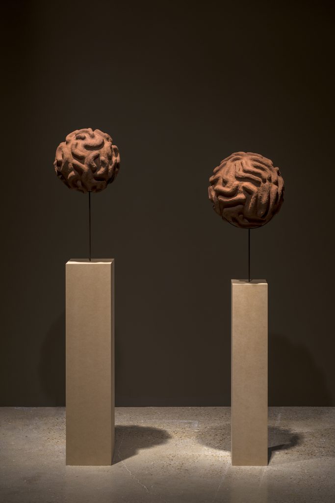 Wangechi Mutu "Dengue Virus II," 2017, and "Dengue Virus," 2017 Red soil, paper pulp, and wood glue
