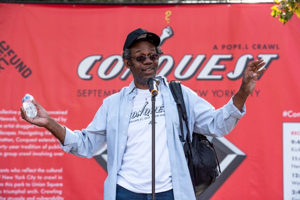Pope.L, "Conquest," 2019. A group crawl featuring 140 participants, 5-hour duration. Commissioned by Public Art Fund and presented on September 21, 2019 in Downtown Manhattan, New York City © Pope.L Photo credit: Timothy Schenck, courtesy of the artist and Public Art Fund