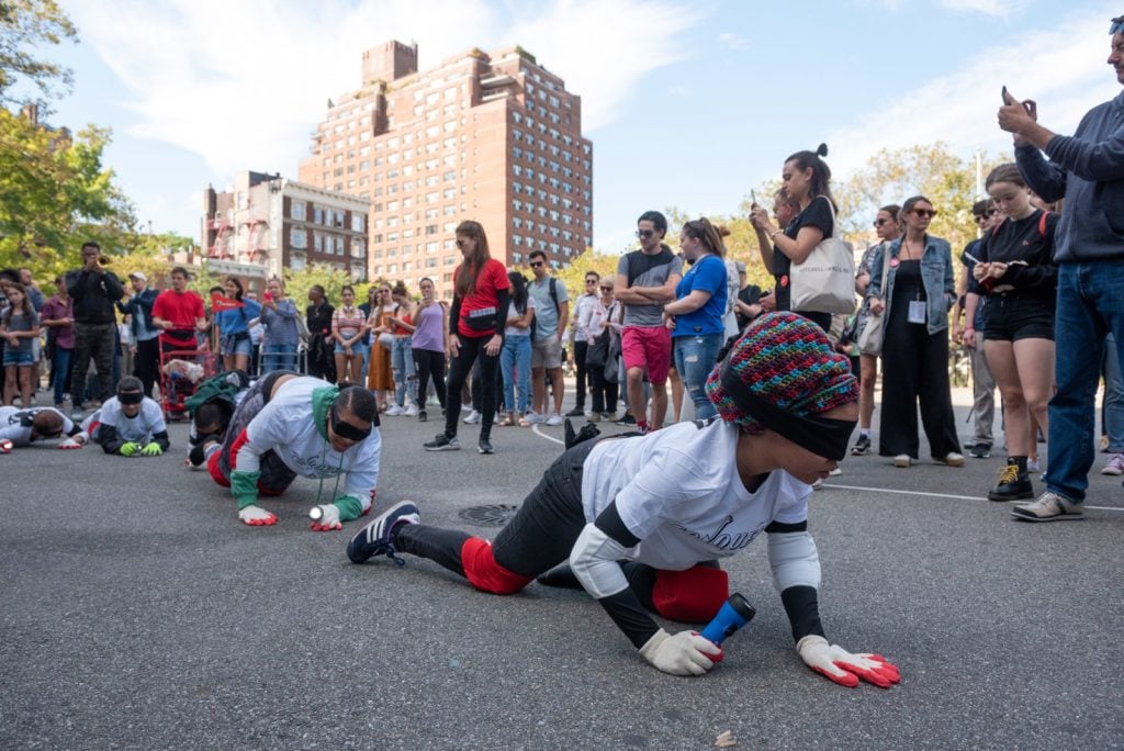 Pope.L, "Conquest," 2019. A group crawl featuring 140 participants, 5-hour duration. Commissioned by Public Art Fund and presented on September 21, 2019 in Downtown Manhattan, New York City © Pope.L Photo credit: Timothy Schenck, courtesy of the artist and Public Art Fund