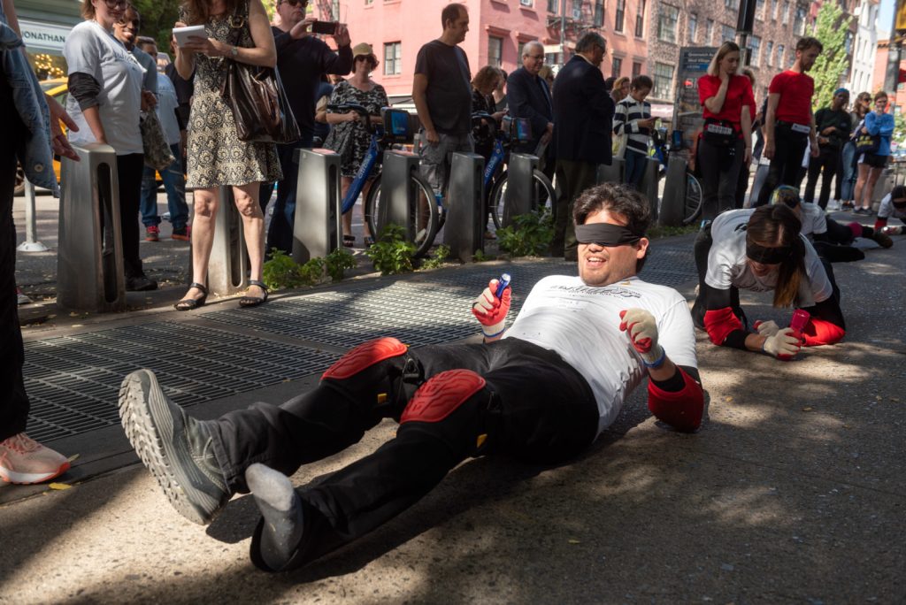 Pope.L, "Conquest," 2019. A group crawl featuring 140 participants, 5-hour duration. Commissioned by Public Art Fund and presented on September 21, 2019 in Downtown Manhattan, New York City © Pope.L Photo credit: Timothy Schenck, courtesy of the artist and Public Art Fund