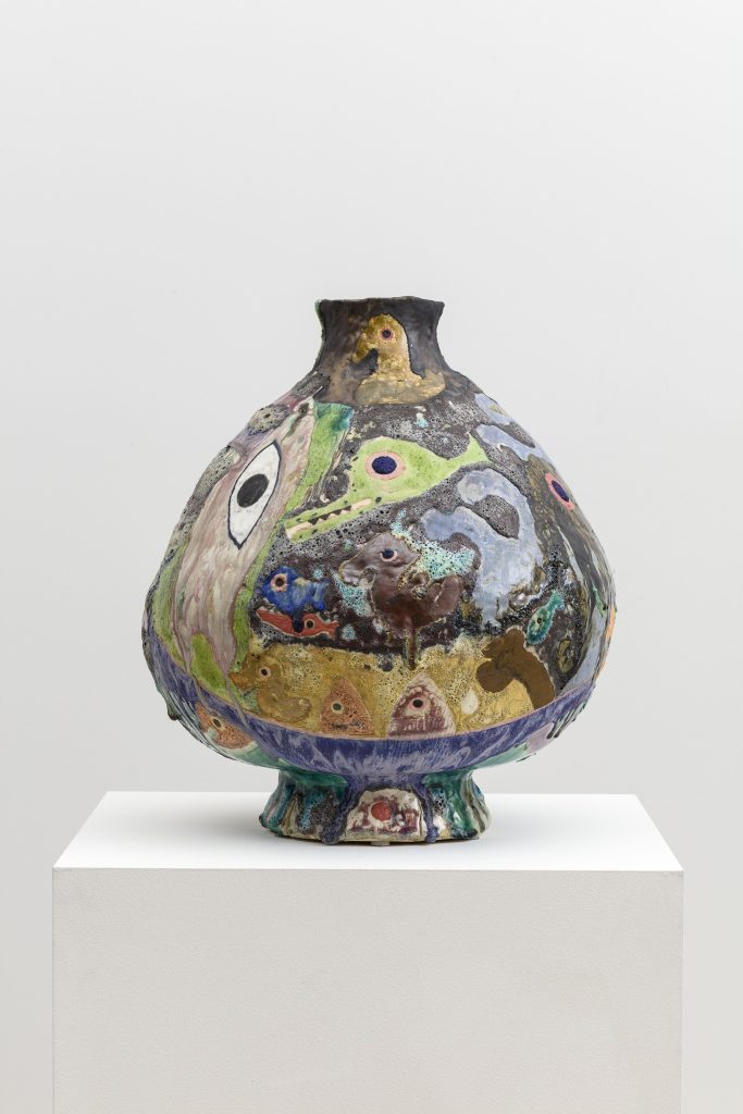 This image depicts an artwork by Tam Van Tran titled "Divinations Jar ll." This artwork was created in 2019 and measures 23" x 19" x 20" [HxWxD] (58.42 x 48.26 x 50.8 cm). Its medium is High fire Ceramic.