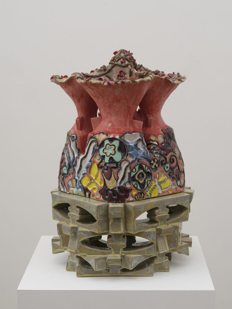 This image depicts an artwork by Bari Ziperstein titled "Four Headed Vessel." This artwork was created in 2024 and measures 30" x 19" x 18" [HxWxD] (76.2 x 48.26 x 45.72 cm) overall. Its medium is Stoneware and glaze.