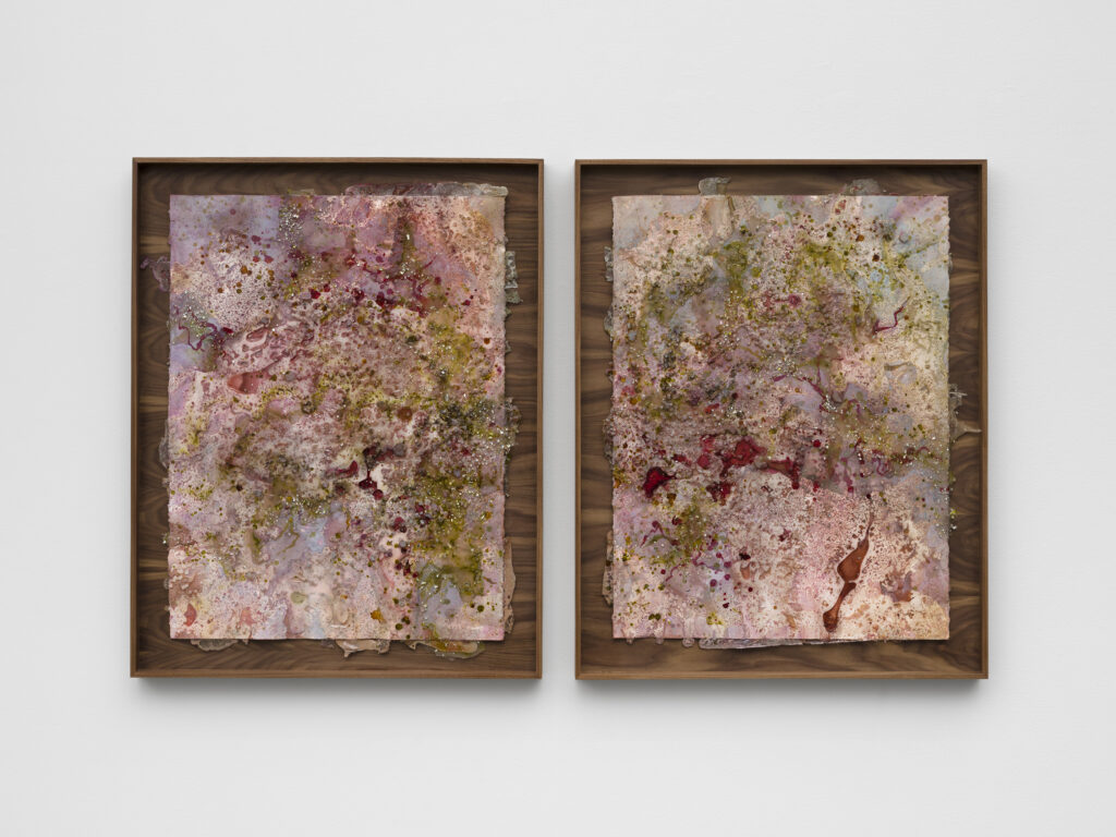 This image depicts an artwork by Tonia Calderon titled "All we want is one memory. That won’t let us down.." This artwork was created in 2025 and measures 30" x 22" [HxW] (76.2 x 55.88 cm) each34 ³⁄₄" x 27 ¹⁄₂" x 2" [HxWxD] (88.26 x 69.84 x 5.08 cm) each; framed. Its medium is Acrylic, floral pigment, ink, fuel, sand, glass and resin on paper.