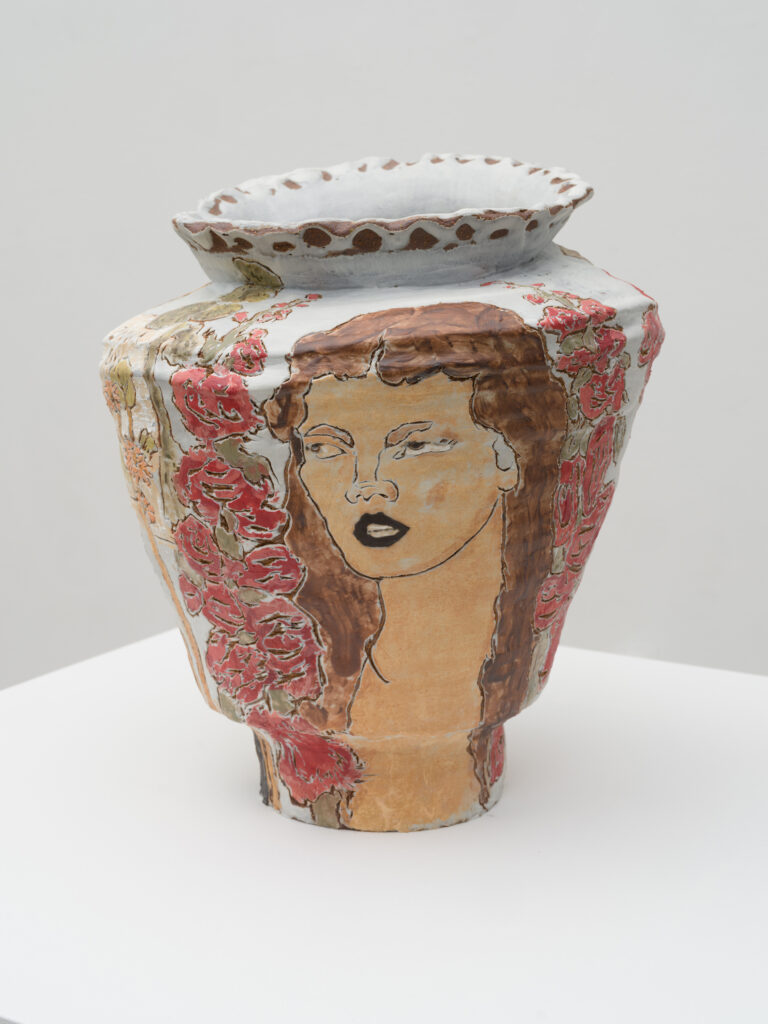 This image depicts an artwork by Shanna Waddell titled "Sheness Dreams of Fruits and Flowers." This artwork was created in 2025 and measures 15" x 12" x 12" [HxWxD] (38.1 x 30.48 x 30.48 cm). Its medium is Ceramic, Underglaze.