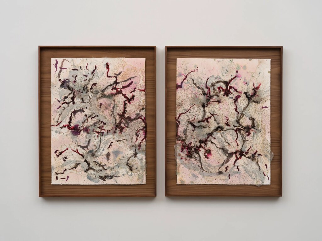 This image depicts an artwork by Tonia Calderon titled "I can feel our roots pressing deeper with each storm. Growing pain.." This artwork was created in 2026 and measures 30" x 22" [HxW] (76.2 x 55.88 cm) each unframed35 ³⁄₄" x 27 ³⁄₄" x 2" [HxWxD] (90.8 x 70.48 x 5.08 cm) each framed. Its medium is Acrylic, Oil, Flower Pigment, Ink, Fuel, Sand, Glass and Resin on Paper.