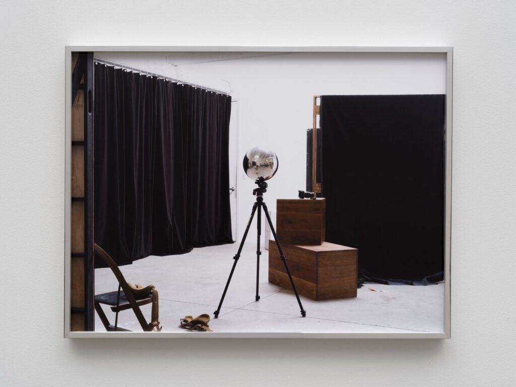 This image depicts an artwork by Paul Mpagi Sepuya titled "Gazing Ball Position 04 (_DSF2692)." This artwork was created in 2024 and measures 24" x 32" [HxW] (60.96 x 81.28 cm) 24 ³⁄₄" x 32 ³⁄₄" x 2" [HxWxD] (62.86 x 83.18 x 5.08 cm) unglazed framed. Its medium is Archival pigment print.